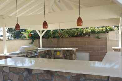 Patio kitchen - mid-sized craftsman backyard patio kitchen idea in Orange County with a gazebo