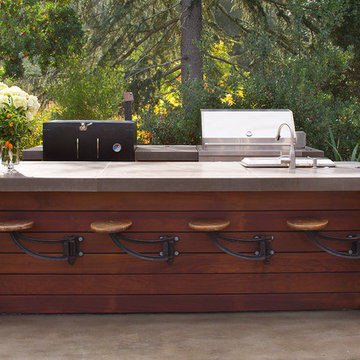 Outdoor Kitchen Featuring Ipe Wood and Antique Stools