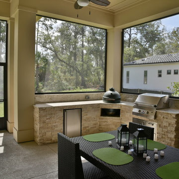 Outdoor kitchen with Big Green Egg and Solaire gas grill.