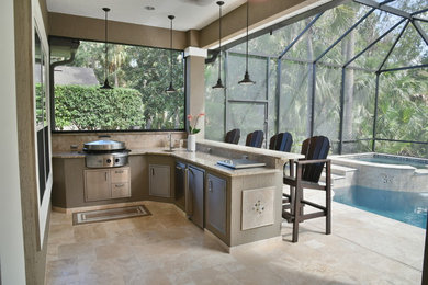 Patio kitchen - mid-sized tropical backyard tile patio kitchen idea in Jacksonville with a roof extension