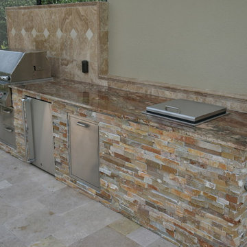 Outdoor kitchen with fireplace.