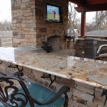 Outdoor Kitchen with Granite Countertops and Massive Open Ceilings