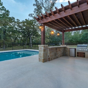 Outdoor Kitchen with Pergola and Pool