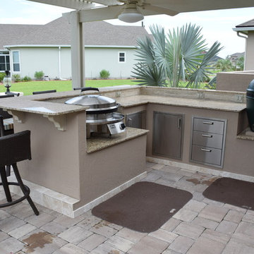 Outdoor Kitchen with pergola, knee wall,  Big Green Egg and Evo.