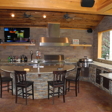 Outdoor kitchen with Solaire Grill, Evo Cooktop, kegerator and more!