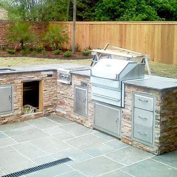 Outdoor Kitchen with stacked stone veneer and Bluestone