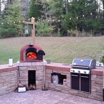 Outdoor kitchen with wood fired pizza oven & gas grill