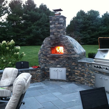 Outdoor kitchen with wood fired pizza oven