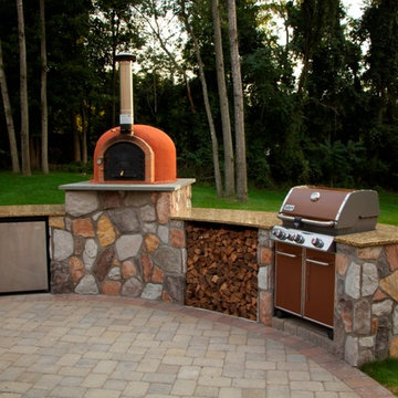 Outdoor kitchen with wood fired pizza oven