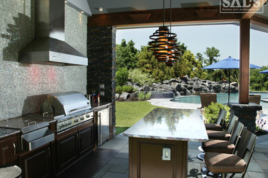 Patio kitchen - mid-sized traditional backyard stone patio kitchen idea in Philadelphia with a roof extension