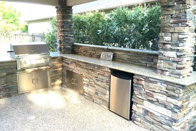 Inspiration for a mid-sized timeless backyard patio kitchen remodel in Houston with a gazebo