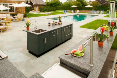 Inspiration for a huge timeless backyard tile patio kitchen remodel in Miami with no cover