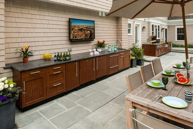 Patio kitchen - mid-sized traditional backyard concrete paver patio kitchen idea in New York with no cover