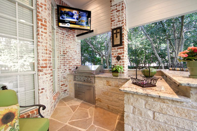Patio kitchen - mid-sized traditional backyard patio kitchen idea in Dallas with a roof extension