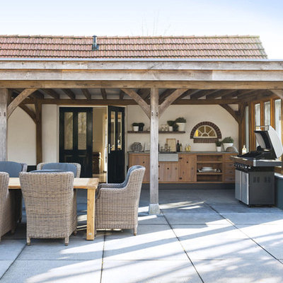 Inspiration for a contemporary patio remodel in Amsterdam with a pergola