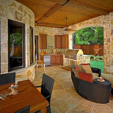 Outdoor living area complete with kitchen and a putting green.