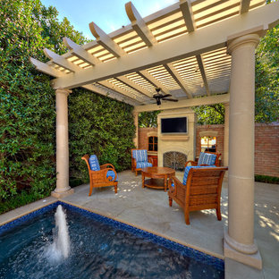 Elegant patio fountain photo in Dallas with a pergola