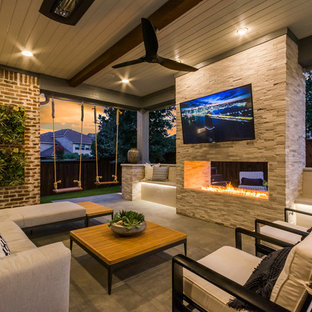 Inspiration for a huge transitional backyard tile patio remodel in Dallas with a roof extension