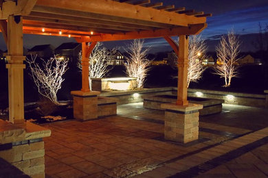Design ideas for a large modern back patio in Other with a fire feature, concrete paving and a pergola.