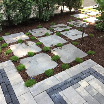 Outdoor Living Space with Gas Fire Pit and Lush Landscapes