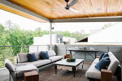 Patio - mid-sized rustic tile patio idea in Atlanta with a roof extension