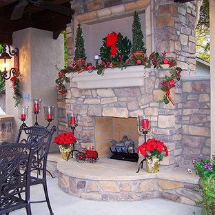 Large tuscan backyard concrete patio photo in Other with a fire pit and a gazebo