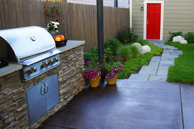 Example of a mid-sized minimalist backyard concrete patio kitchen design in Denver with a gazebo
