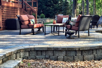 Inspiration for a mid-sized timeless backyard patio remodel in Charlotte with decking and a pergola