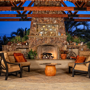 Outdoor patio cover with stone fireplace