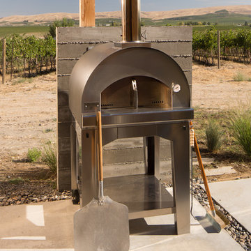 Outdoor pizza oven overlooking vineyards at the base of Red Mountain.