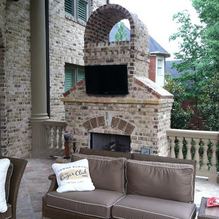 Patio - mid-sized traditional backyard brick patio idea in Atlanta with a fire pit