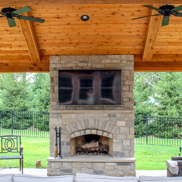 Outdoor Room with a Fireplace and Kitchen Feature