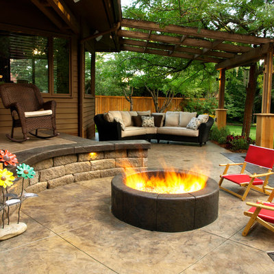Example of a trendy patio design in Seattle with a fire pit and a pergola