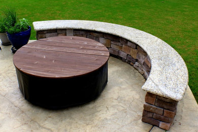 Inspiration for a traditional back patio in Other with a fire feature, stamped concrete and no cover.