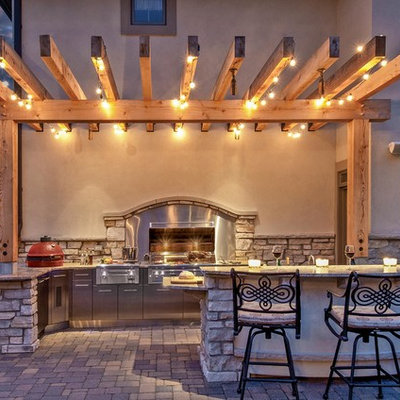 Elegant patio kitchen photo in Bridgeport with a pergola