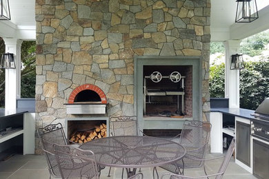 Patio kitchen - mid-sized traditional backyard concrete paver patio kitchen idea in New York with a gazebo