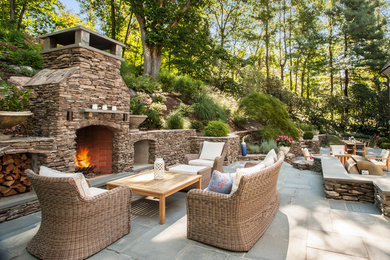 Photo of an expansive traditional back patio in New York with no cover and a bbq area.