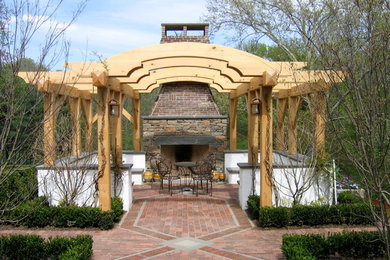 Inspiration for a traditional patio in Philadelphia with brick paving and a pergola.