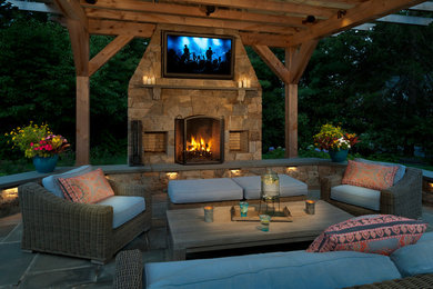 Patio - large traditional backyard concrete paver patio idea in New York with a fire pit and a pergola