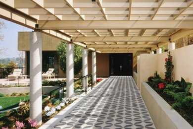 Patio vertical garden - huge contemporary backyard tile patio vertical garden idea in Miami with a pergola