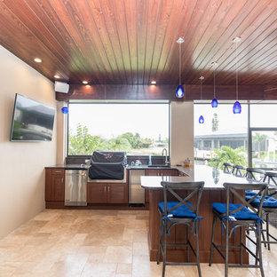 Inspiration for a mid-sized timeless backyard tile patio kitchen remodel in Miami with a roof extension