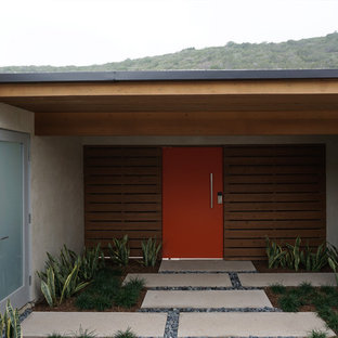Patio - small mid-century modern courtyard concrete patio idea in Orange County with a pergola