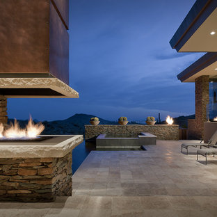 Patio - southwestern patio idea in Phoenix with a fire pit