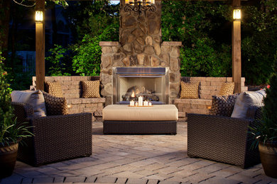 Patio - traditional patio idea in Charlotte with a fire pit and a gazebo