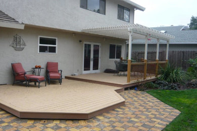 Inspiration for a mid-sized timeless backyard patio remodel in Sacramento with a pergola