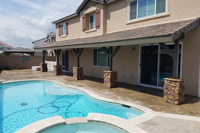 Patio - large traditional backyard patio idea in Los Angeles with no cover