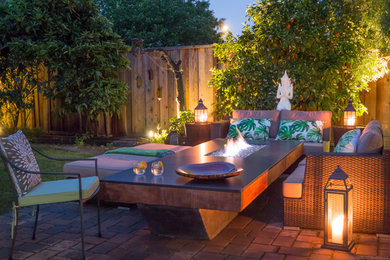 Patio - mid-sized transitional backyard stone patio idea in San Francisco with a fire pit and no cover