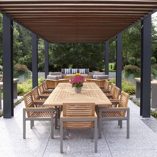 Example of a trendy patio design in Minneapolis with a pergola
