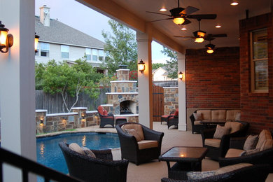Inspiration for a large timeless backyard concrete patio remodel in Austin with a fire pit and a roof extension