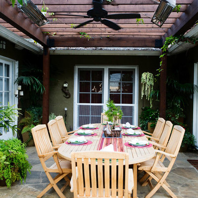 Example of a trendy patio design in Los Angeles with a pergola